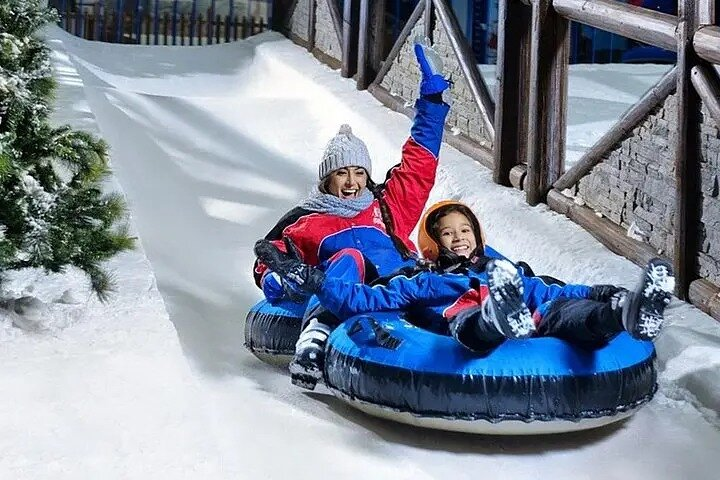 Experience the joy of winter fun at Ski Dubai where families bond while tubing down snowy slopes and creating unforgettable memories in a remarkable indoor snow paradise.